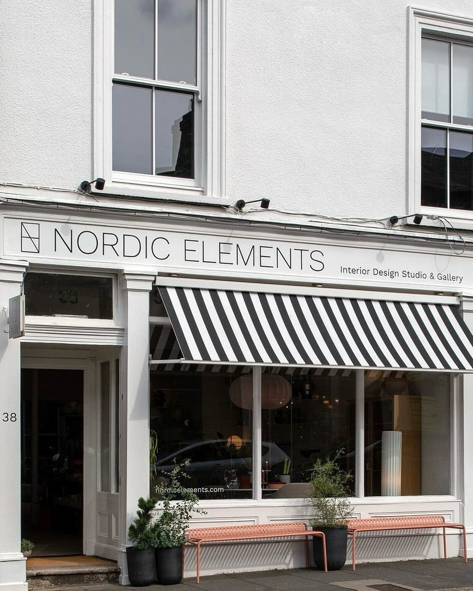 Nordic Elements Dublin storefront with black and white striped awning and modern decor