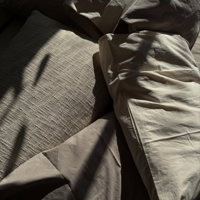 TAMEKO's Tate cushion in natural and Cove duvet, pillowcase and bedsheet in natural