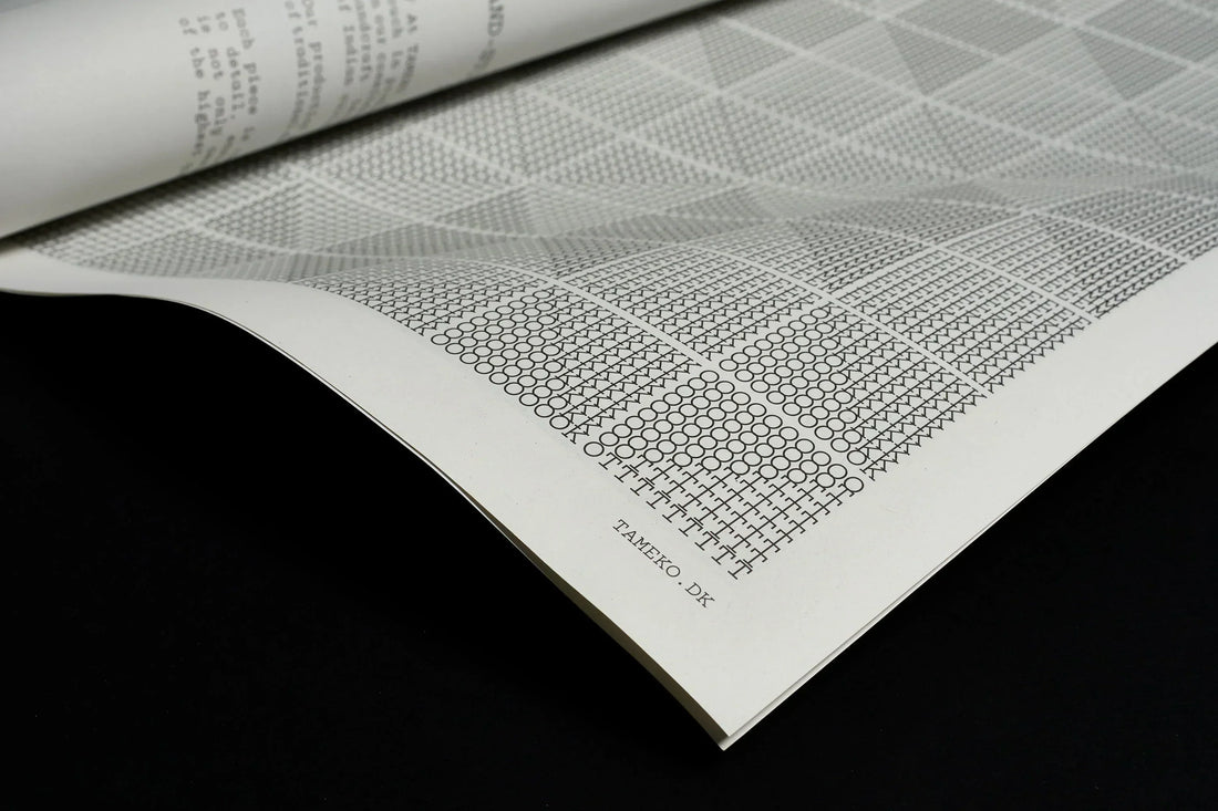 Close-up of TAMEKO fabric pattern guide with geometric designs on white paper
