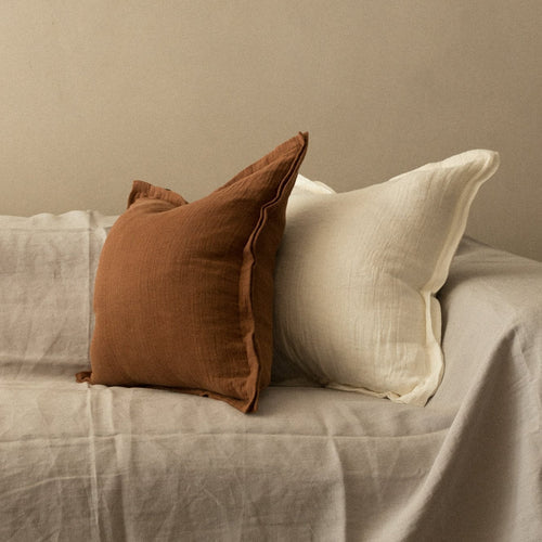 Brown and white linen throw pillows on beige fabric sofa, TAMEKO home decor