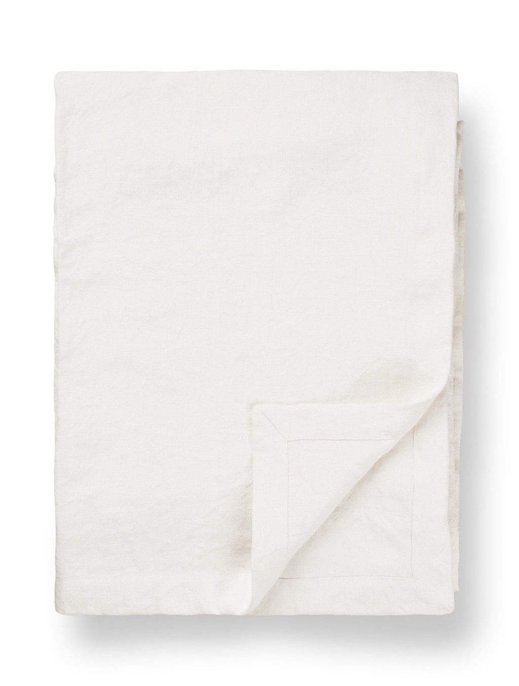 White linen tablecloth with folded corner, minimalist TAMEKO home table fabric