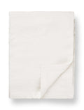 White linen tablecloth with folded corner, minimalist TAMEKO home table fabric