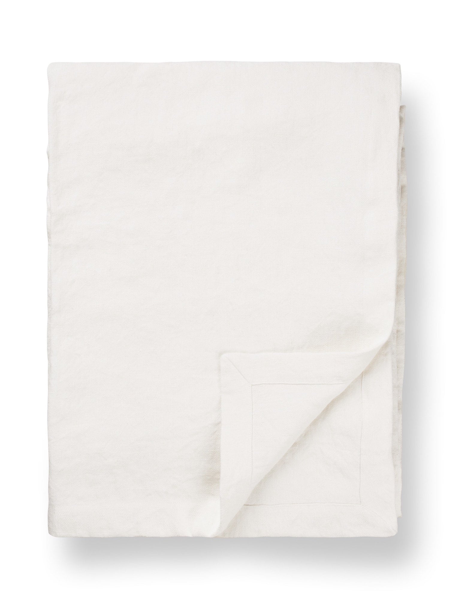 White linen tablecloth with folded corner, minimalist TAMEKO home table fabric