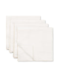 Set of 4 white Merrow napkins neatly stacked, TAMEKO table linen, minimalist design