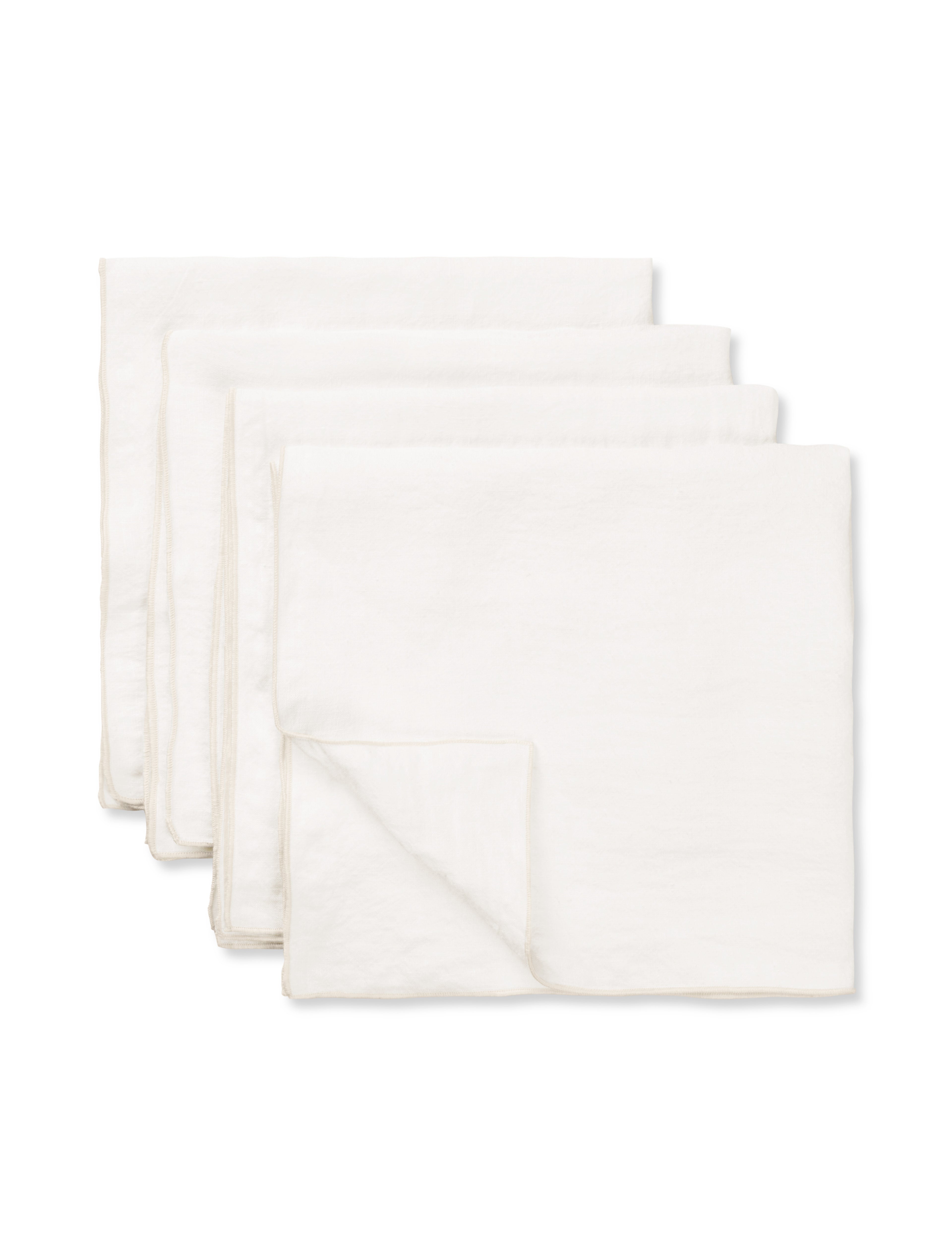 Set of 4 white Merrow napkins neatly stacked, TAMEKO table linen, minimalist design