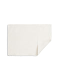 TAMEKO white Rue placemat with a natural texture, folded corner, tabletop linen